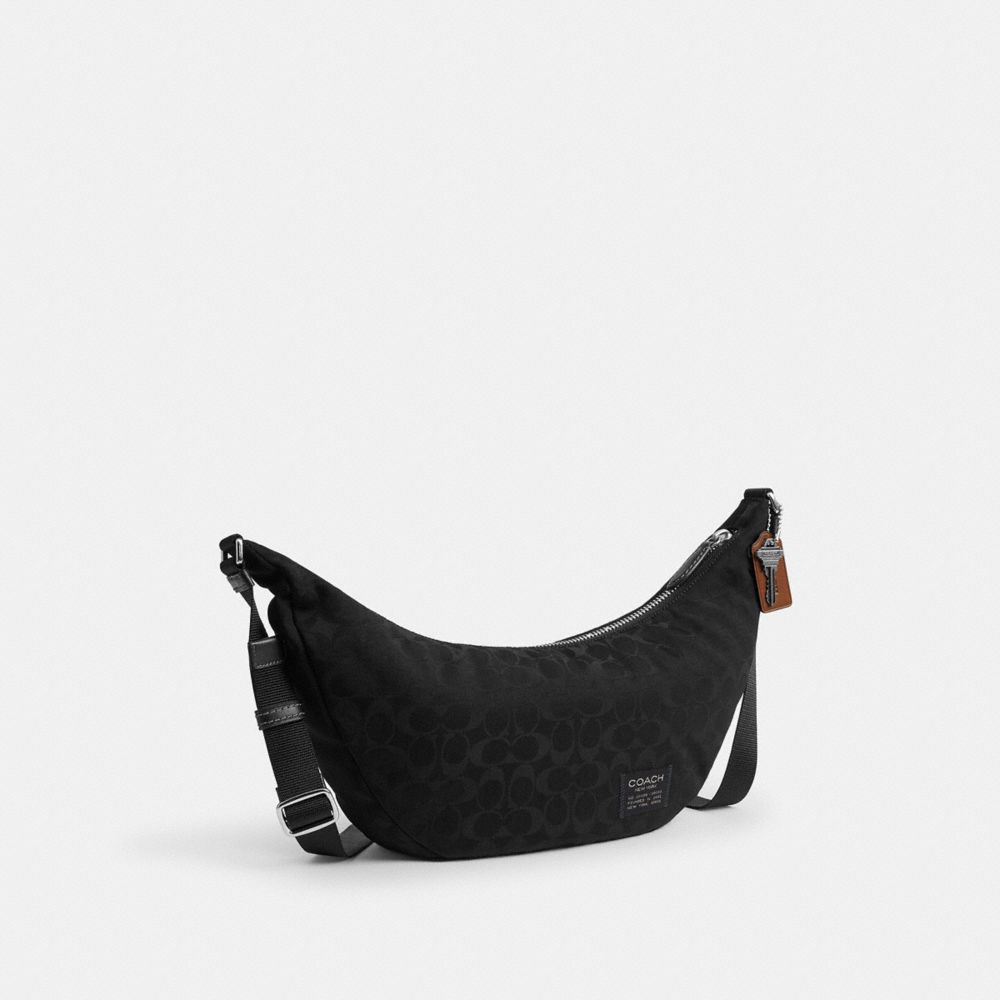 Coach Leon Sling Bag In Signature Nylon Jacquard Black