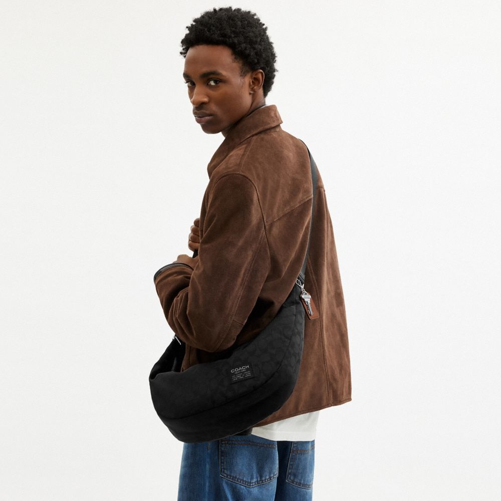 Coach Leon Sling Bag In Signature Nylon Jacquard Black