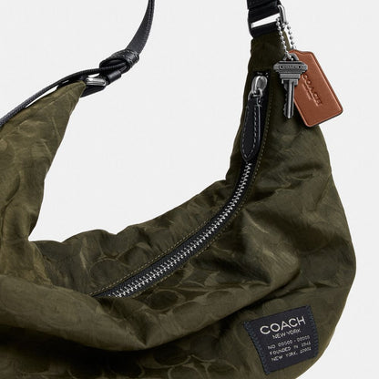 Coach Leon Sling Bag In Signature Nylon Jacquard Dark Moss