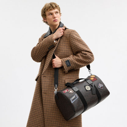 Coach Explorer Duffle Bag 45 In Signature Canvas With Patches Sv/Walnut/Black