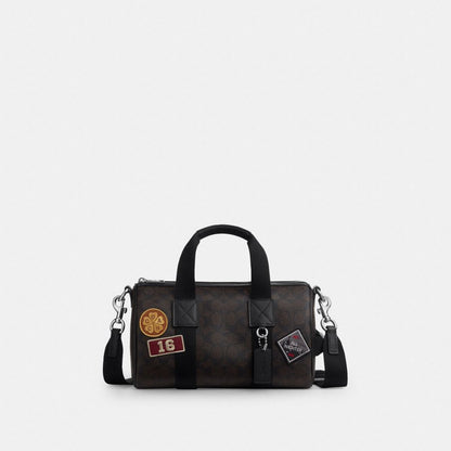 Coach Explorer Duffle Bag 28 In Signature Canvas With Patches Sv/Walnut/Black