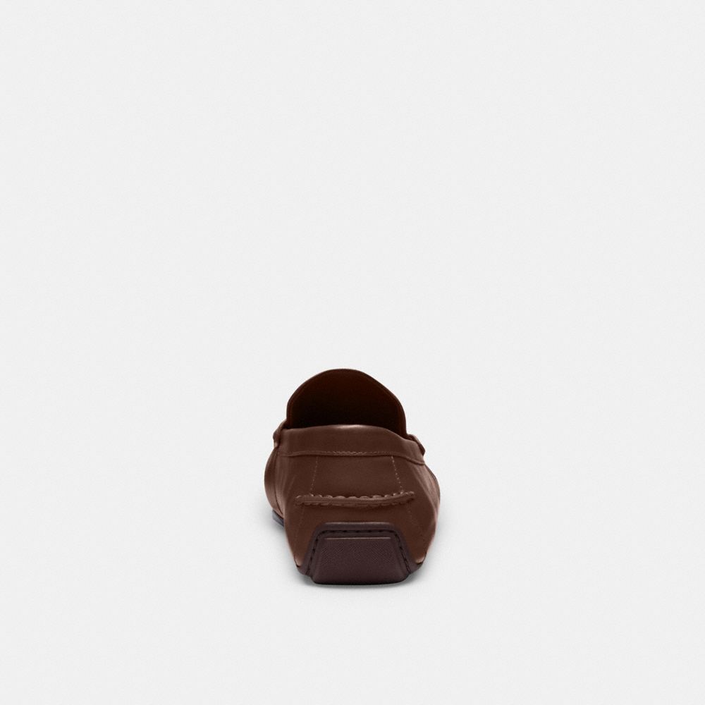 Coach Liam Driver In Signature Jacquard Dark Saddle
