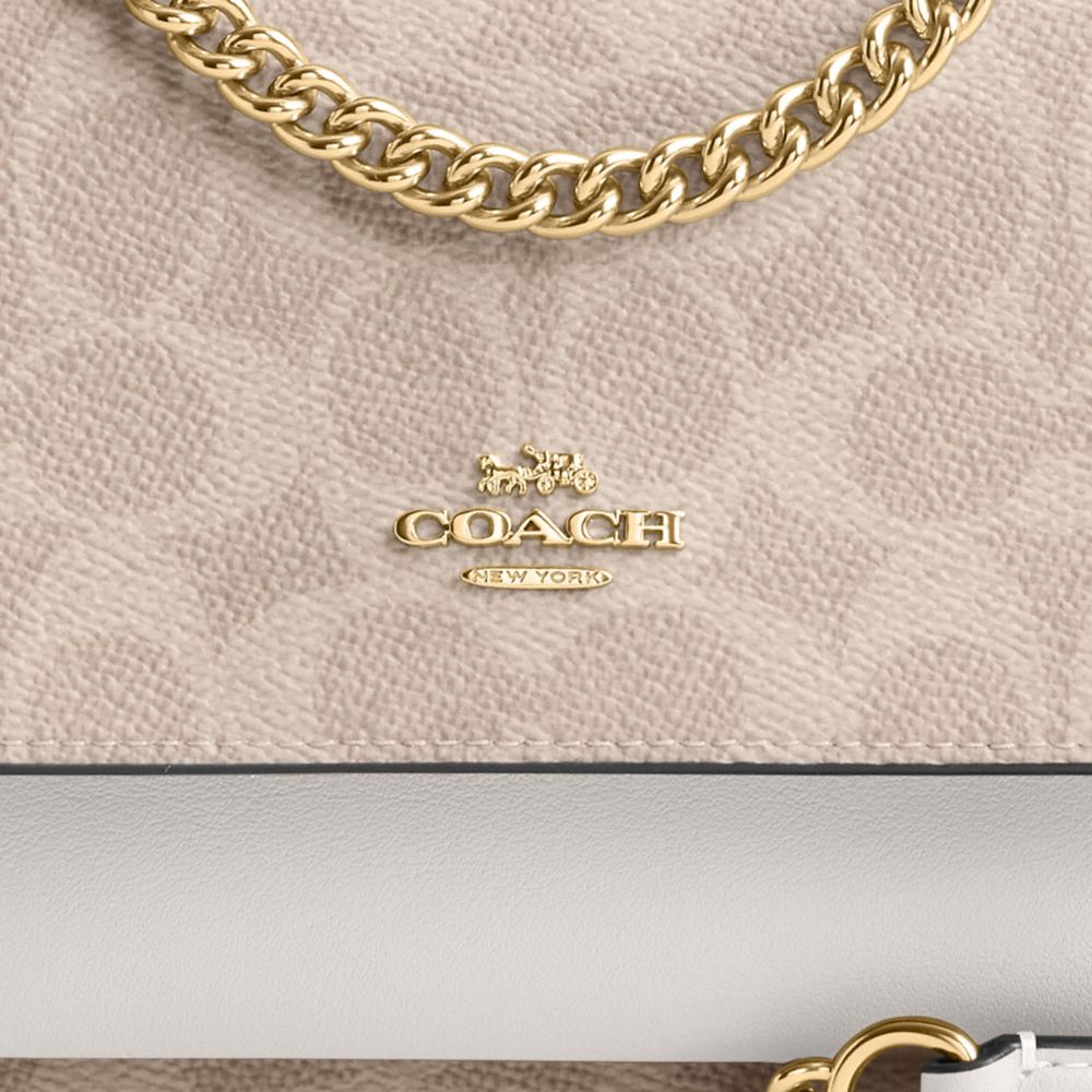 Coach Mini Klare Crossbody Bag In Signature Canvas Gold Sand Chalk