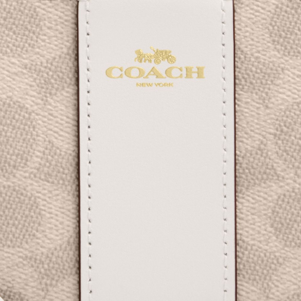 Coach Corner Zip Wristlet In Signature Canvas With Stripe Gold Sand Chalk
