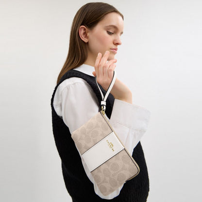 Coach Corner Zip Wristlet In Signature Canvas With Stripe Gold Sand Chalk