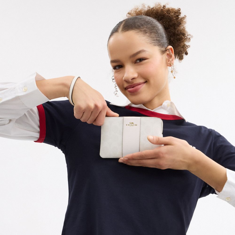 Coach Corner Zip Wristlet In Signature Canvas With Stripe Gold White Chalk