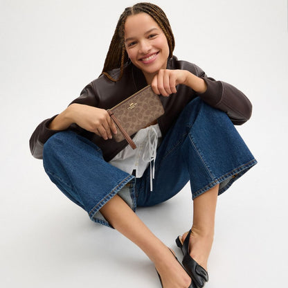 Coach Large Corner Zip Wristlet In Signature Canvas Gold Tan Brown