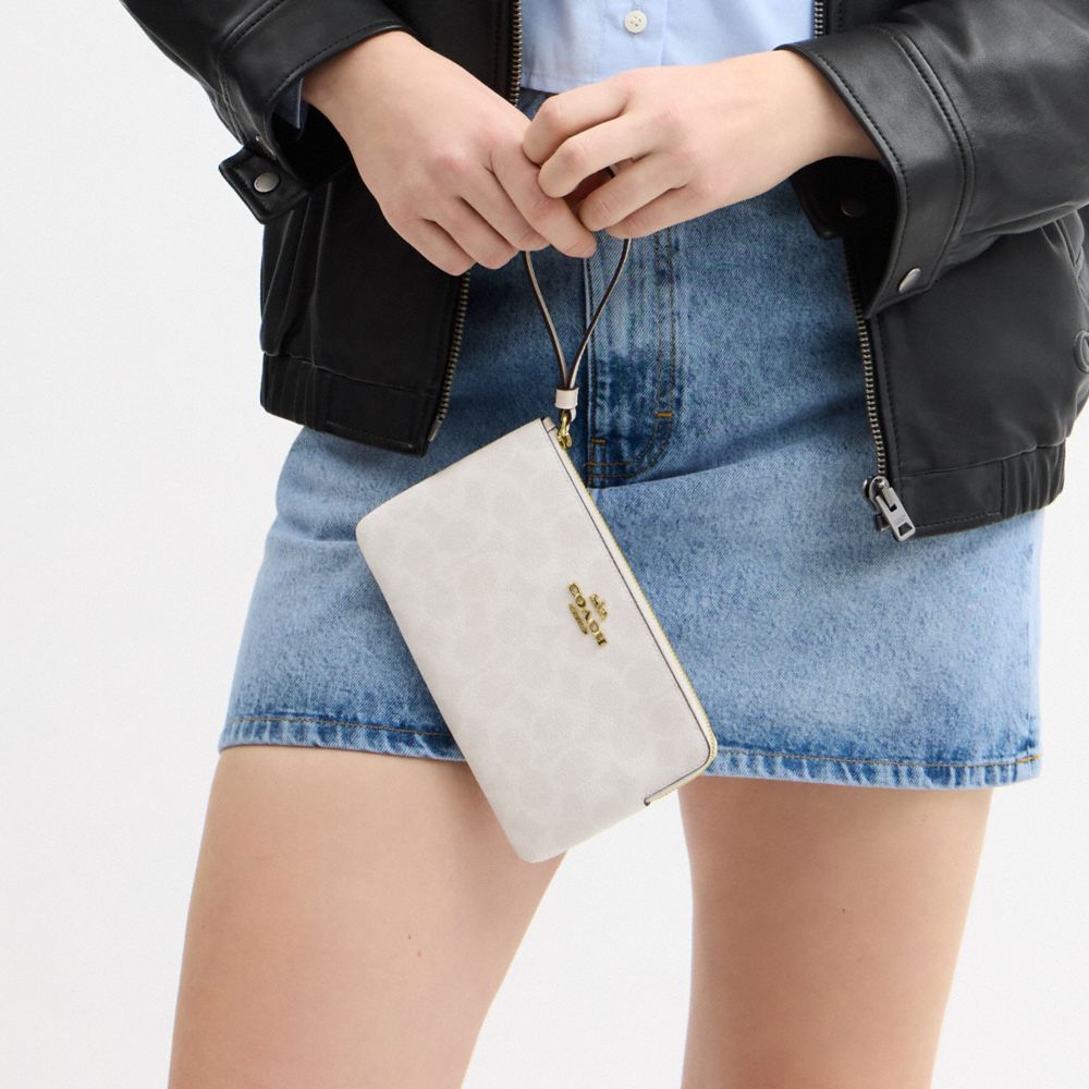 Coach Large Corner Zip Wristlet In Signature Canvas Gold White Chalk