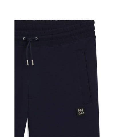 Hugo Stacked Logo Tracksuit Bottoms In A Cotton Blend Dark Blue