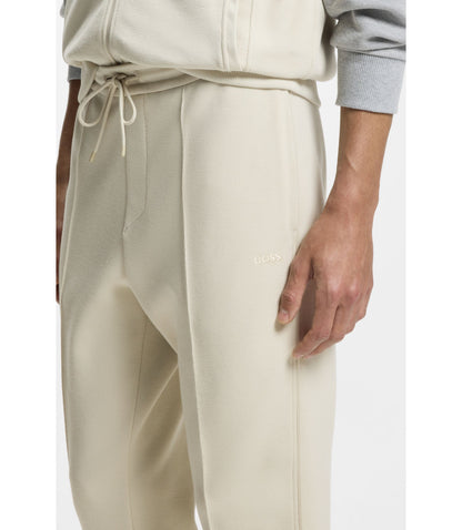 Boss Piping Detail Tracksuit Bottoms In A Cotton Blend Light Beige
