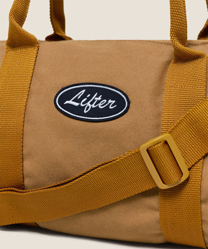 Gymshark Strength Dept Mini Canvas Duffle Bag Antique Gold